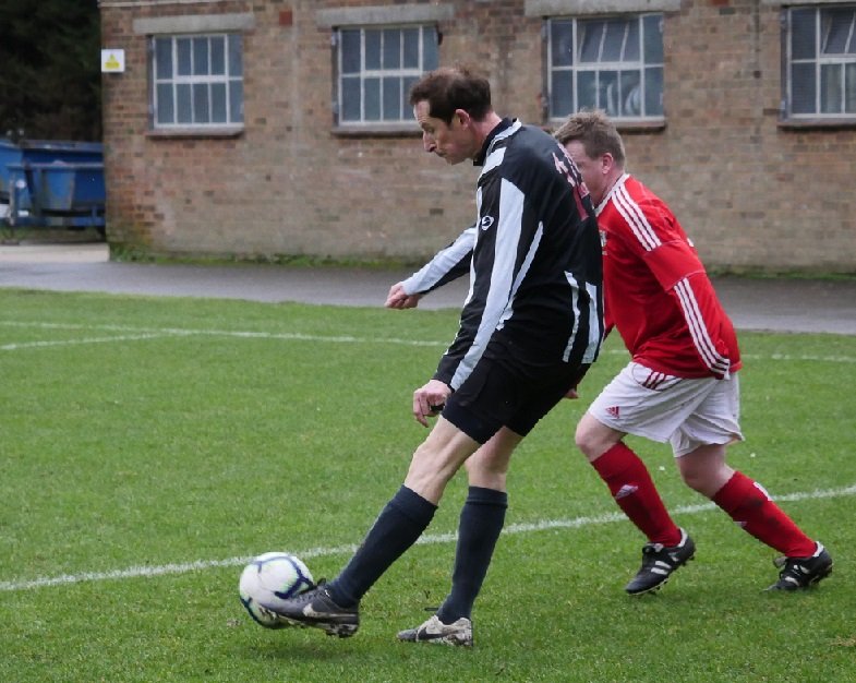 Skipper John Wyn-Evans crosses from the right